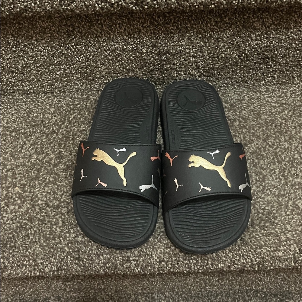 Puma Black Slides with Gold and Multicolor Accents